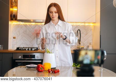 Pretty Attractive Redhead Woman Vlogger Shooting Video Food Blog About Making Healthy Vegetable Deto