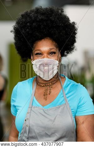 Smiling woman wearing a mask during the new normal