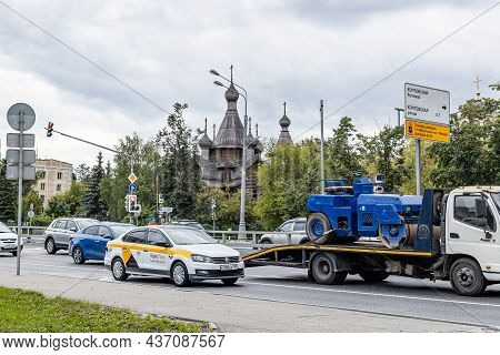 Moscow, Russia - August 24, 2021: Car Traffic Near Wooden Church Of The Holy Great Martyr George The
