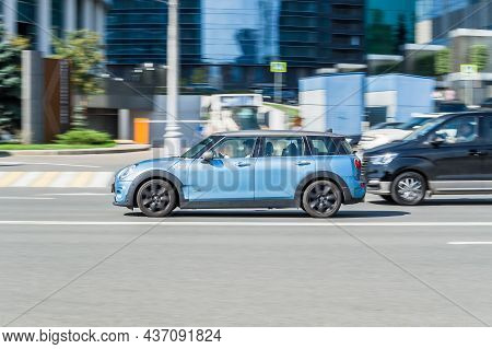 Moscow, Russia - August 2021: Mini Clubman All4 Tests In Sunny Day On City Road. Blue Car Driving Al
