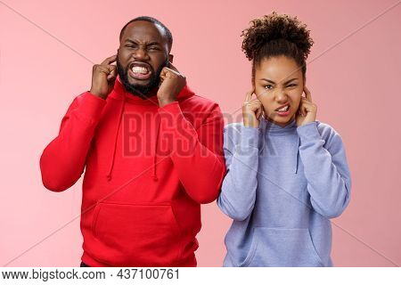 Irritated Annoyed Couple African American Siglings Man Woman Cringing Discomfort Close Ears Plug Fin
