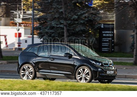 Moscow; Russia - October 13; 2021: Black Bmw I3  Is Driving Fast On The Street On A Warm Autumn Day 