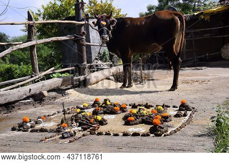 Beautiful Shape Or Artwork Made Of Cow Dung, Indian Rural Woman Worshiping, Govardhan Puja On Diwali