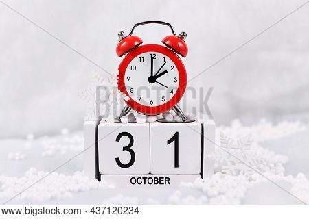 Time Change For Daylight Saving Winter Time In Europe On October 31st Concept With Red Alarm Clock A