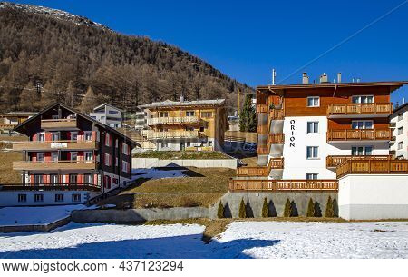 Switzerland, Saas-fee, December, 2015 - Modern And Old Wooden Hotels On A Bright Sunny Day In The Ch