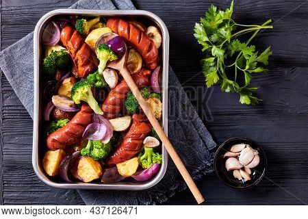 Sausage And Vegetable Traybake With Smoked Pork Sausage, Broccoli, Potato, Red Onion, Garlic On A Ba