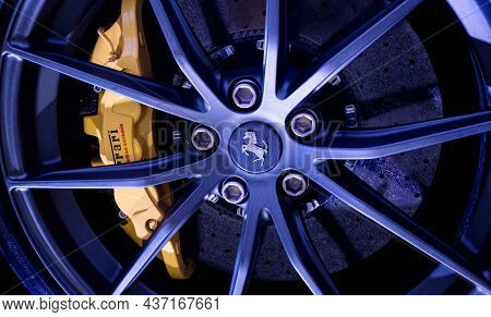 Modena, Italy - July 14, 2021: Black Prancing Horse On Yellow Logo On Gray Ferrari F12tdf Tour De Fr