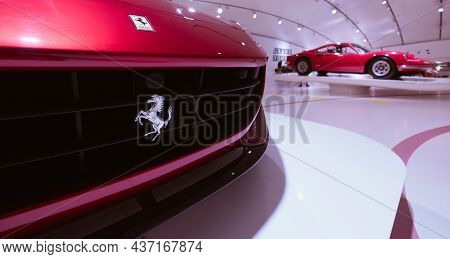 Modena, Italy - July 14, 2021: Black Prancing Horse On Yellow Logo On Gray Ferrari F12tdf Tour De Fr