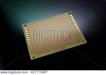 Empty Clear Universal Prototype Printed Circuit Board On Background