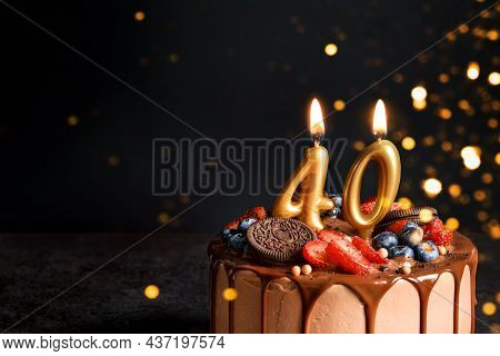 Chocolate Birthday Cake With Berries, Cookies And Number Fourty Golden Candles On Black Background, 
