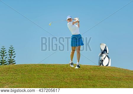 Golfer Sport Course Golf Ball Fairway. People Lifestyle Woman Playing Game Golf Tee Of Blue Sky Back