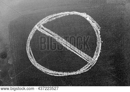 White Color Chalk Hand Drawing In Cross Circile Shape On Black Board Background