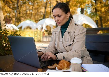 African American Business Woman Typing On Laptop In A Forest Cafe While Enjoying Remote Work In The 