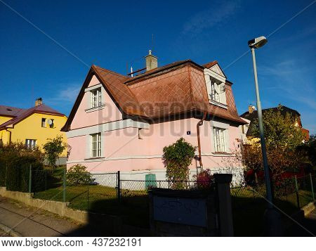 Prague, Czech Republic - October 24, 2021: Small Old Rural House With Pink Facade During Beautiful S