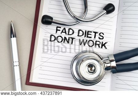 Medicine Concept. On The Table Is A Stethoscope, A Pen And A Notebook In Which It Is Written - Fad D
