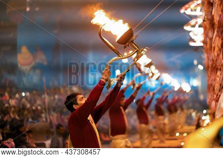 17.12.2019, Varanasi, India. Sacred Religious Ceremony Arati In The Temple. Men Standing In A Row Ho