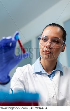 Scientist Doctor Holding Blood Vacutainer Analyzing During Biochemistry Experiment In Microbiology H