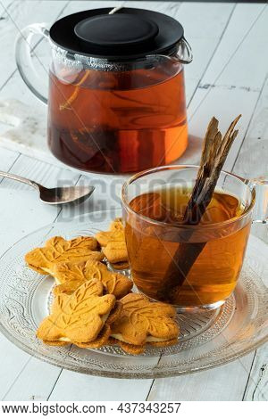Pumpkin Cookies On A Glass Plate With A Cup Of Cinnamon Chia Tea.