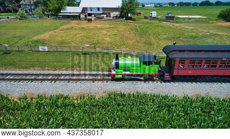 Ronks, Pennsylvania,june 2019 - Aerial View Of Percy The Tank Engine Approaching Thru Trees And Farm