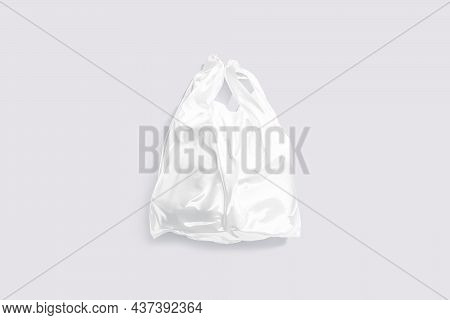 Blank White Full T-shirt Plastic Bag Mockup, Gray Background, 3d Rendering. Empty Poly Parcel Or Bag