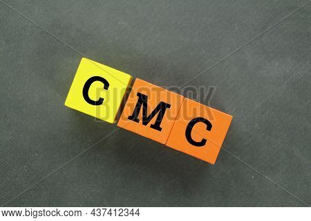 Orange And Yellow Cubes With The Letters Cmc
