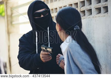 Thief Armed Man Rob Woman By Gun On Street So Scared Shocked Face. Frightened Asian Woman Was Rob Ag