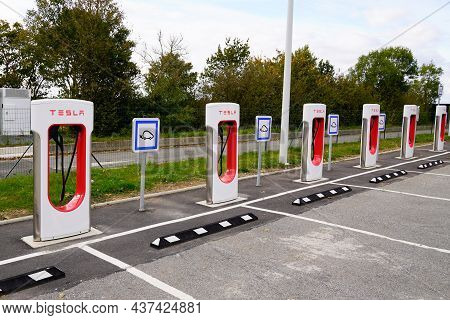 Bordeaux , Aquitaine France - 10 20 2021 : Tesla Parking Super Charged Brand Car Logo Sign Advertisi