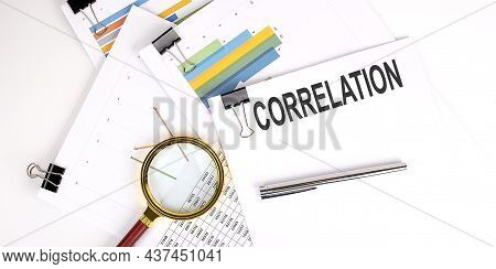 Correlation , Text On White Paper On Light Background With Charts Paper