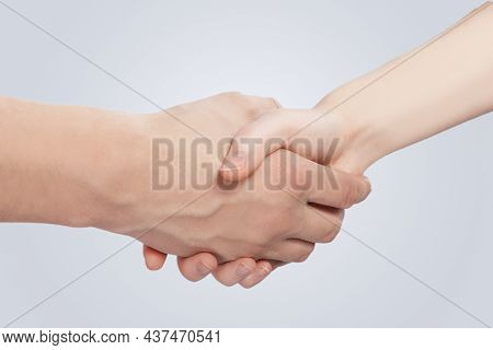 Two Hands Of Caucasian Couple Connected Together Demonstrating Support And Encuragement Of Two Lovin