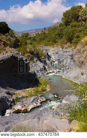 Gole Alcantara Sicilian National Park. Alcantara River Gorge Canyon With Volcanic Lava Caves And Roc