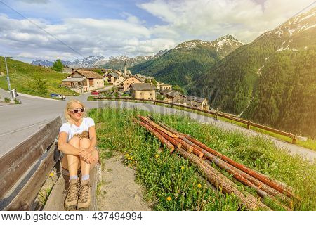 Woman Looking At Panorama Above Guarda Village Of The Scuol Municipality In Switzerland. Lookout Of 
