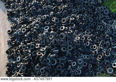 Landfill With Old Tires And Tyres For Recycling. Reuse Of The Waste Rubber Tyres. Disposal Of Waste 