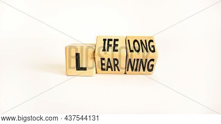 Lifelong Learning Symbol. Turned Wooden Cubes With Concept Words 'lifelong Learning' On A Beautiful 