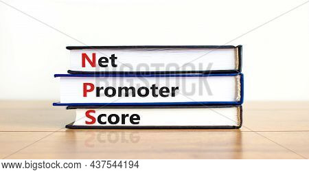 Nps Net Promoter Score Symbol. Books With Words 'nps Net Promoter Score'. Beautiful Wooden Table, Wh