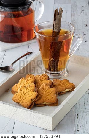 A Tray Of Pumpkin Cookies With A Cup Of Cinnamon Tea For Snacking.