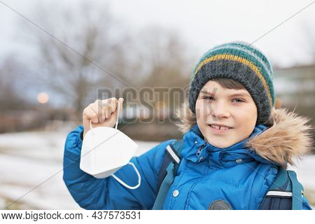 Kid Boy Wearing Ffp Medical Mask On The Way To School. Child Backpack Satchel. Schoolkid On Cold Aut