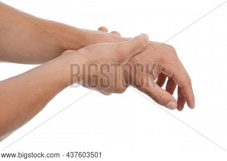 Young European Man Suffer From Wrist Pain And Pressing Hand To Sore Spot, Isolated On White Backgrou