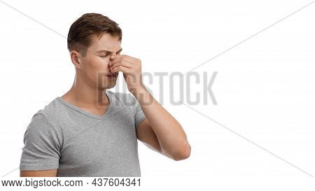 Upset Sad Millennial European Man Suffering From Runny Nose Or Headache, Touching Face