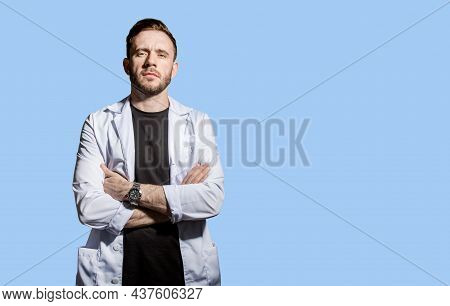 Doctor In A White Coat With A Magnifying Glass. Concept-search For Medicines, Vaccines, And Vaccinat