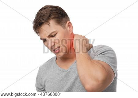 Sad Handsome Young Caucasian Guy Suffer From Neck Pain, Presses Hand To Sore Spot, Indicated In Red