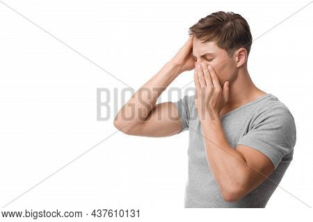 Upset Young Caucasian Man Suffering From Headache, Runny Nose, Feeling Unwell