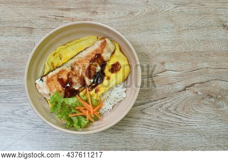 Grilled Salmon With Egg Dressing Teriyaki Sauce Topping On Japanese Rice In Bowl