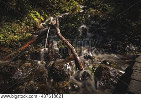 A Small Creek With Pipeline In The Alps Of Austria