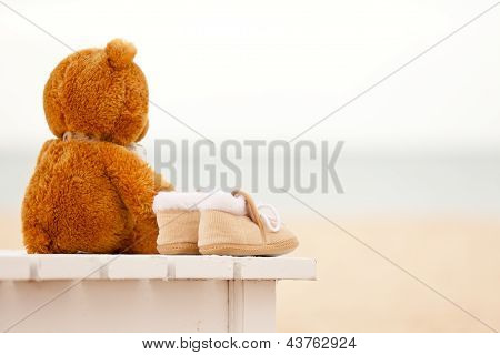 Teddy-Bear magány és Bootees baba marad szolárium