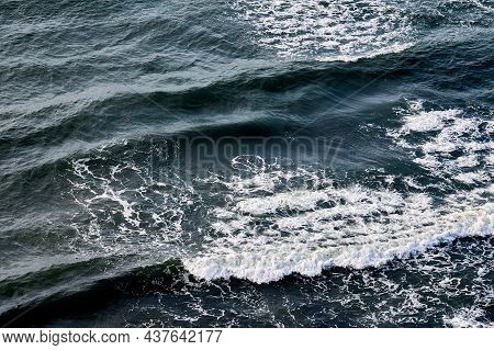 Deep Blue Sea Waters Splashing With Foamy Waves. Aerial View Of Ocean Splashing Waves, Dark Blue Wav