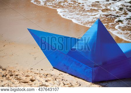 Origami Blue Paper Boat On Sandy Beach For Concept Design, Beautiful Paper Ship On Shore. Modern Art