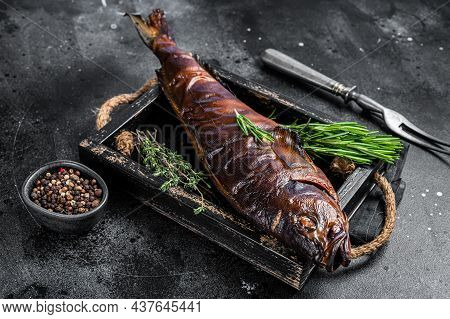 Hot Smoked Pike Perch Or Zander Fish In A Wooden Tray. Black Background. Top View