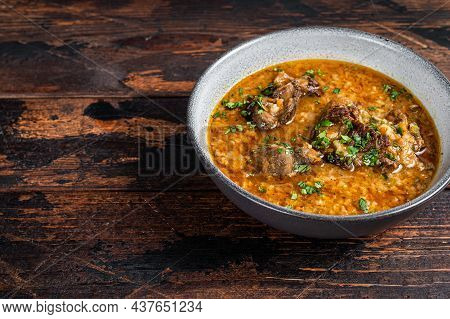 Kharcho Beef Meat Soup With Rice, Tomatoes And In A Bowl. Dark Wooden Background. Top View. Copy Spa