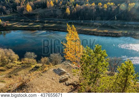 A Picturesque Top View Of The Sylva River And The Autumn Trees Growing Nearby. Photo Taken In Kurgur