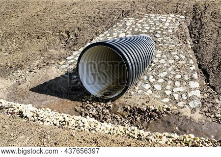 A New Modern Plastic Culvert Under The Highway With A Decorative Cobblestone Finish